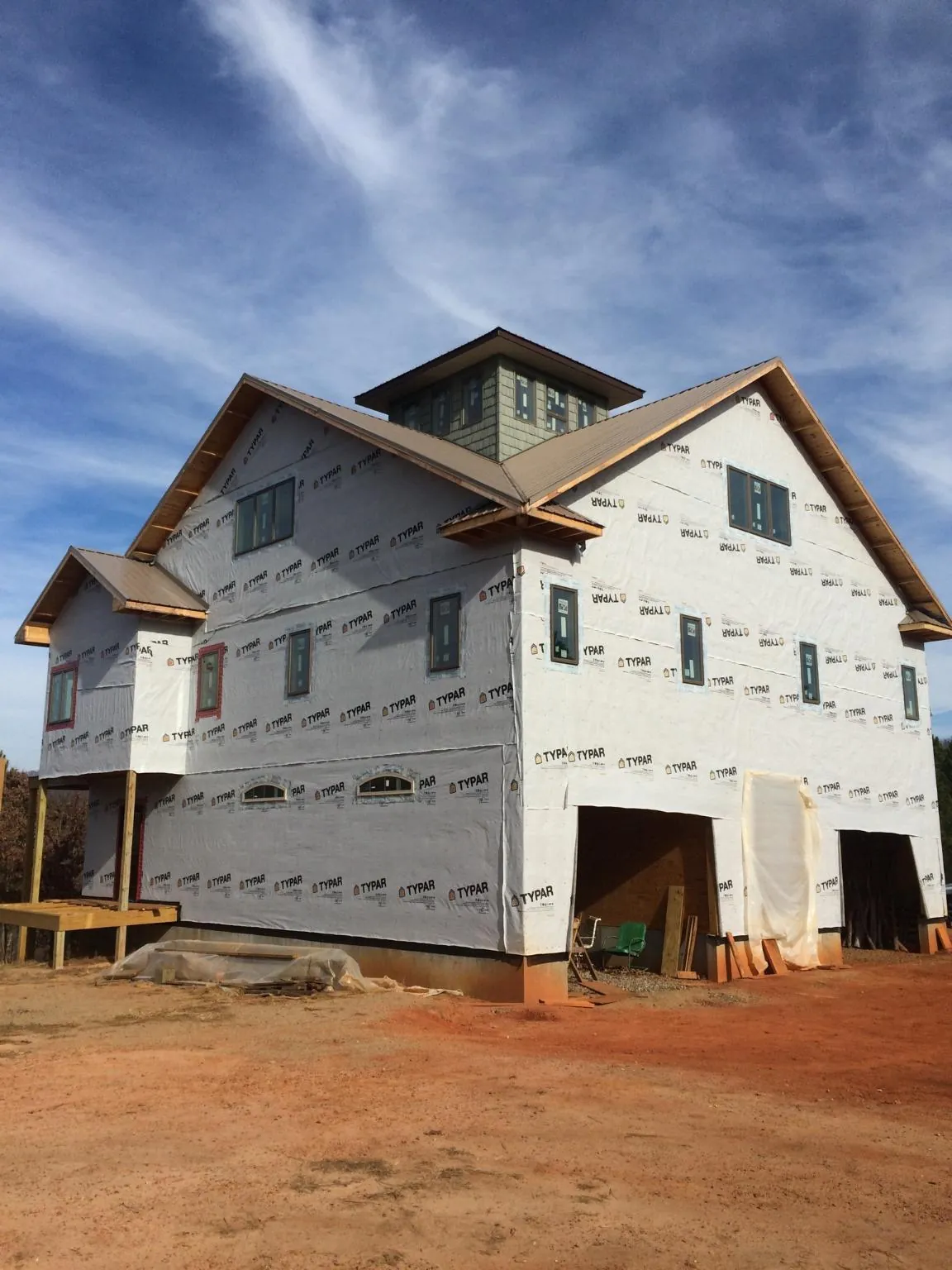 New two story house under construction with a cupola and gabled roofs in Somerdale